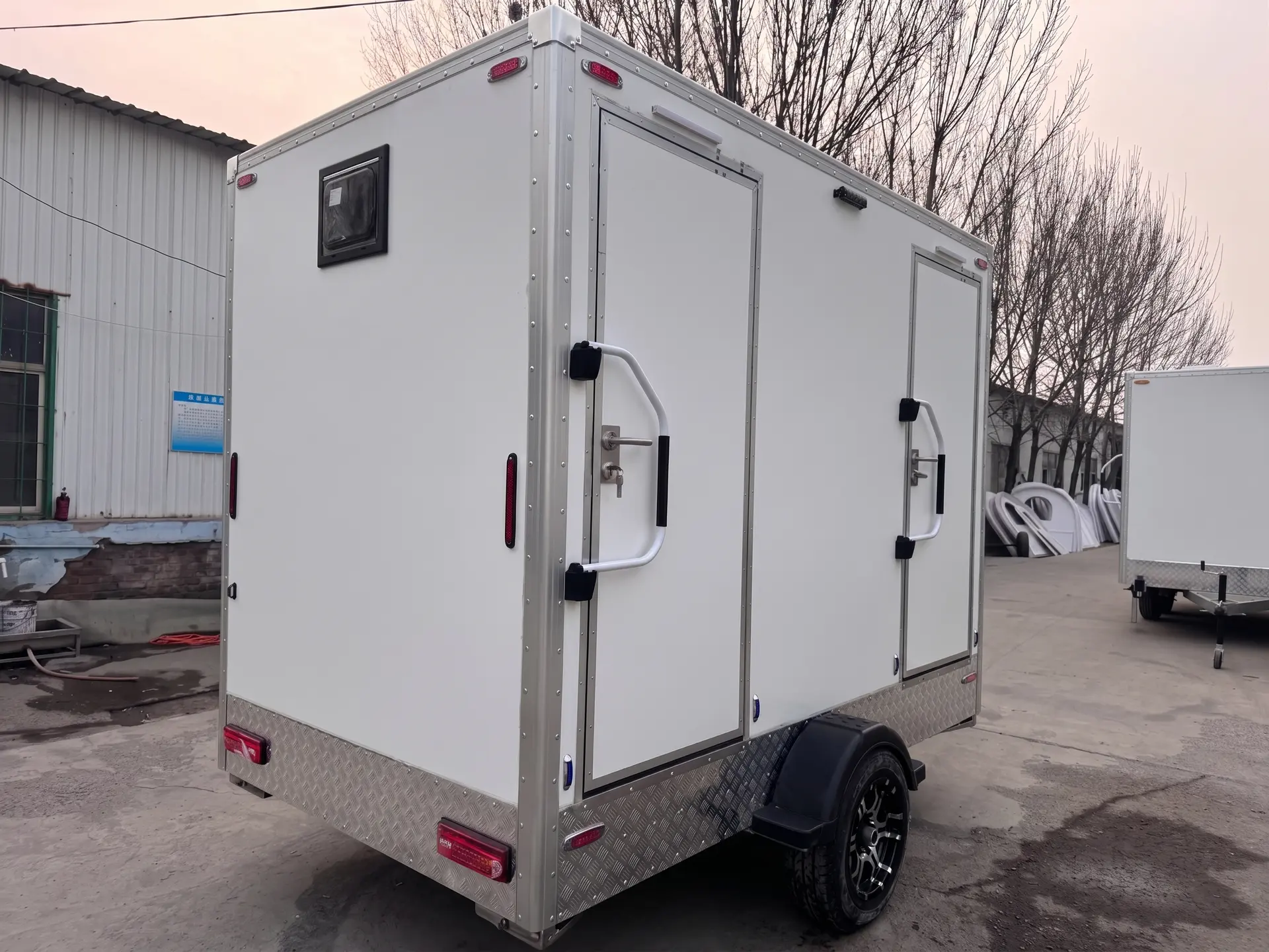 Luxury Loos restroom trailer rental in Tulsa, Oklahoma — two-door trailer